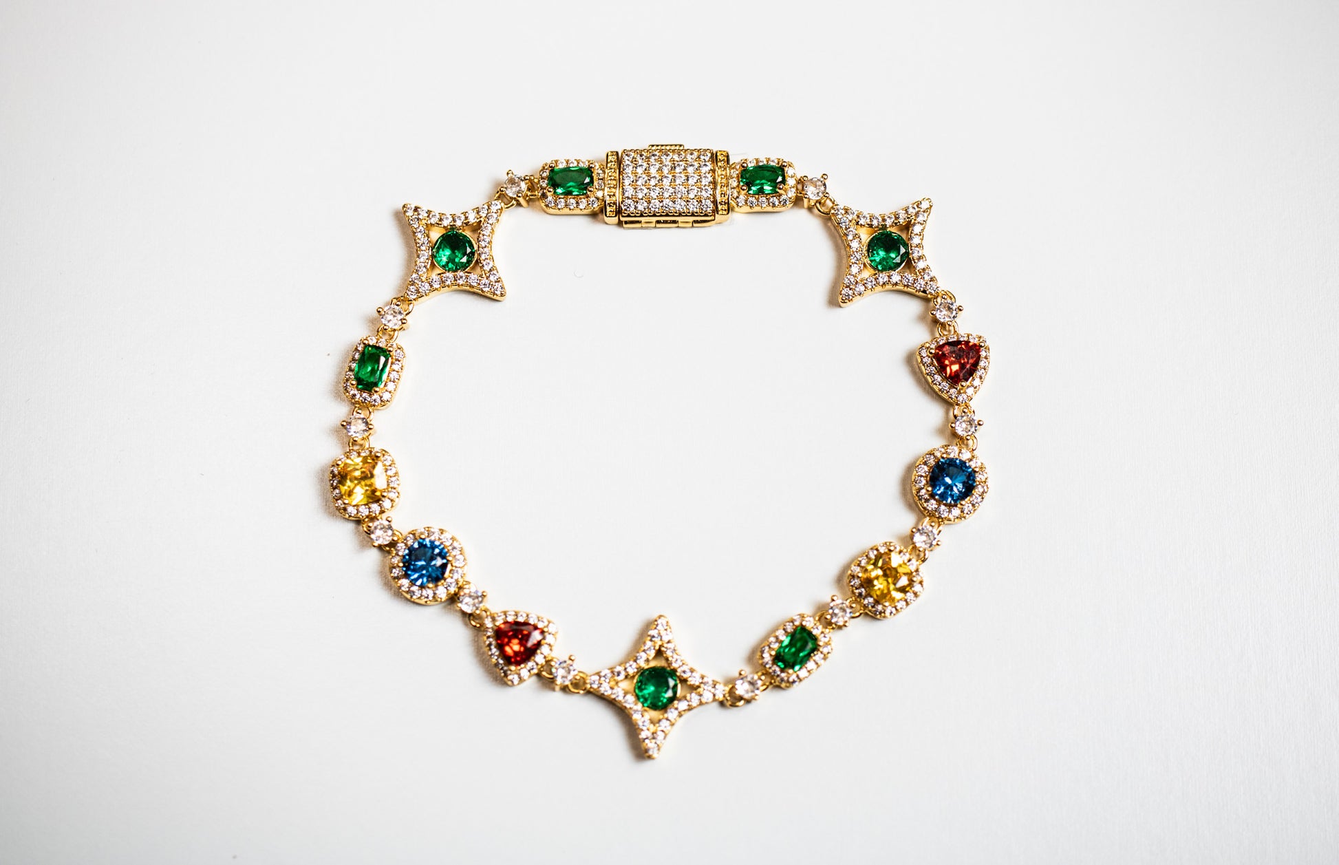 Gold bracelet with colorful gemstones on a white background- Multicolor-Gemstone-Bracelet JCollins-Jewelry