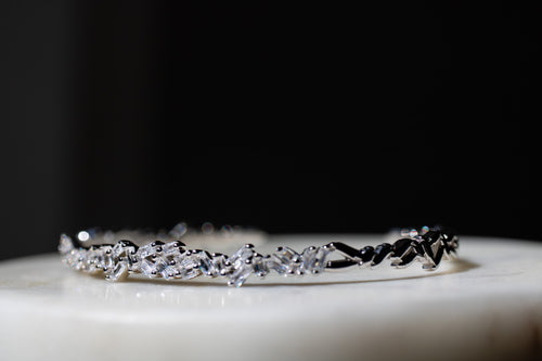 Silver bracelet with clear stones on a dark background-Crystal-Eclat-Cuff-JCollins-Jewelry