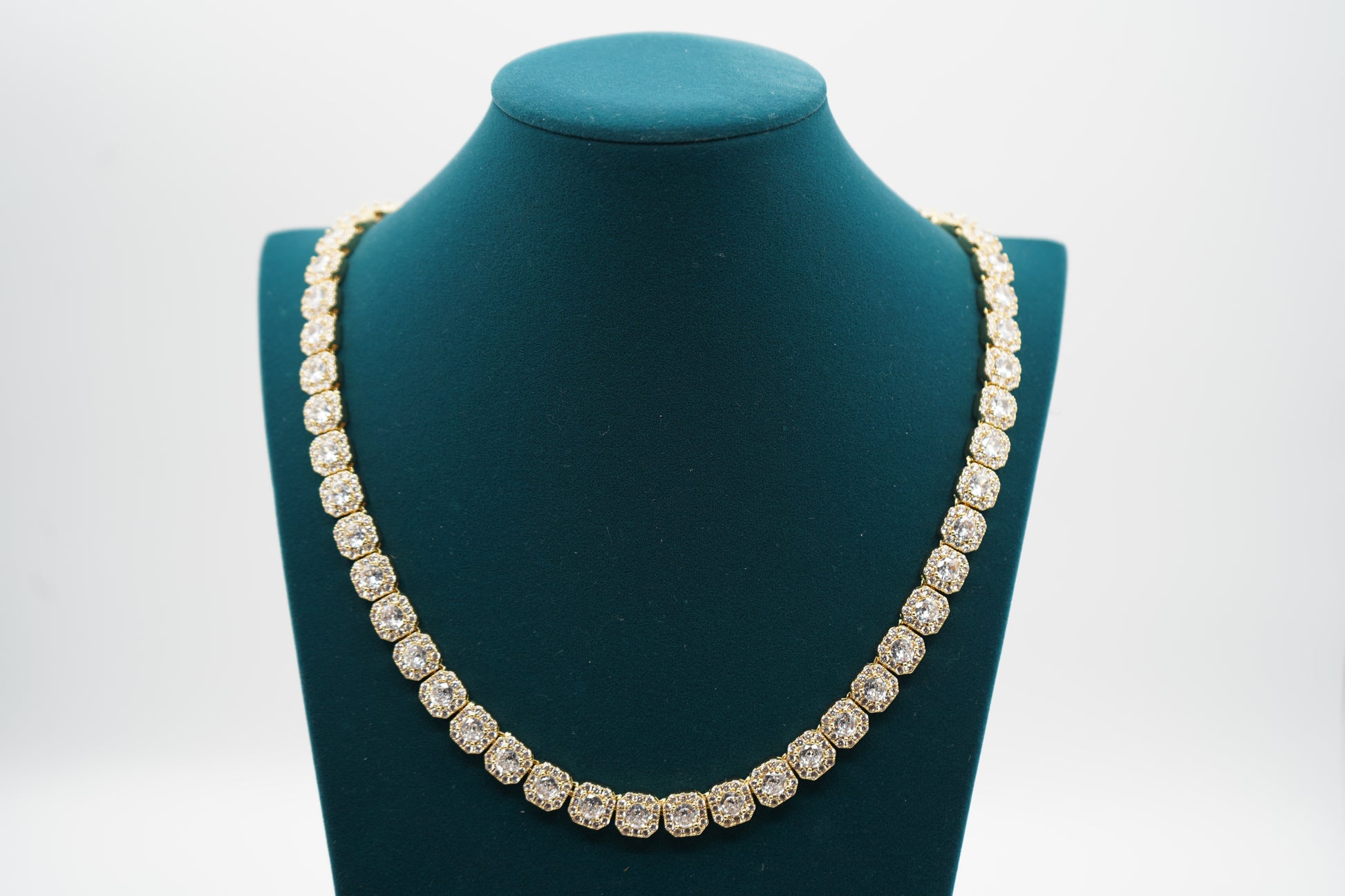 Diamond necklace on a green mannequin bust with a white background-10mm-Tennis-Chain-JCollins-Jewelry