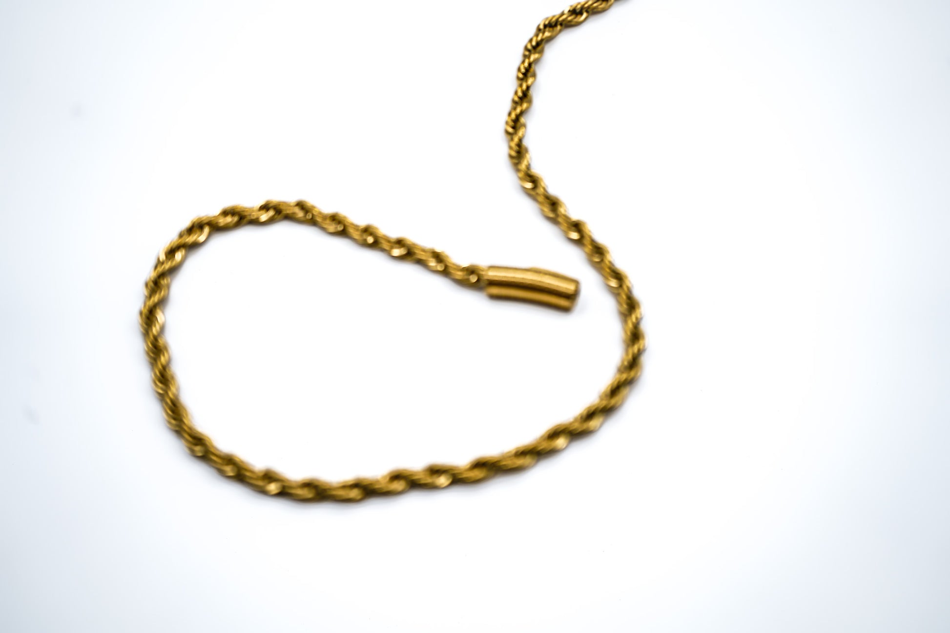 Gold chain necklace on a white background-Essential-Rope-Chain-JCollins-Jewelry
