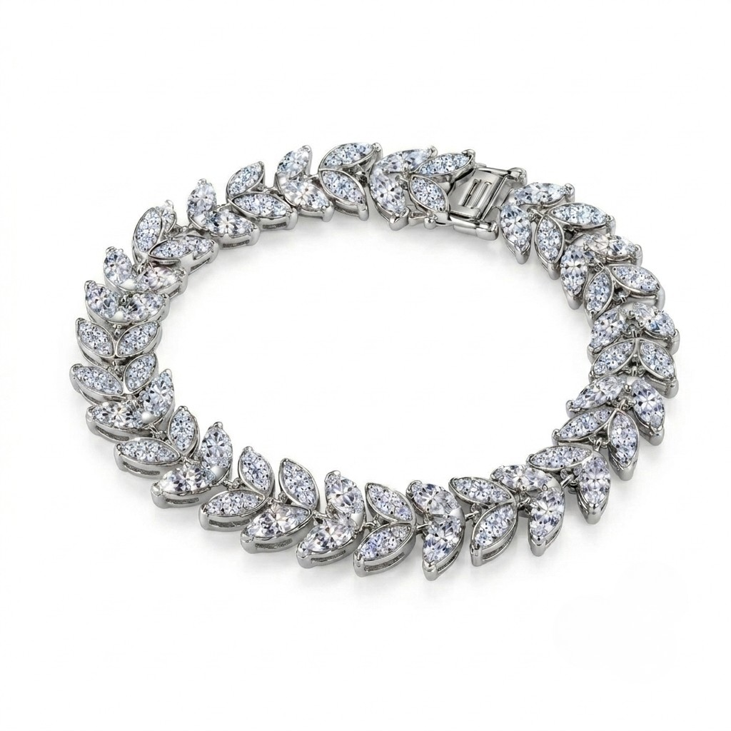 A white gold tennis bracelet featuring marquise-cut clear stones arranged in a continuous leaf pattern, shown on a plain white background - J.Collins Jewelry