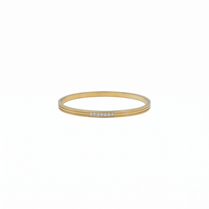 Gold bangle with embedded stones on a white background-J.Collins Jewelry
