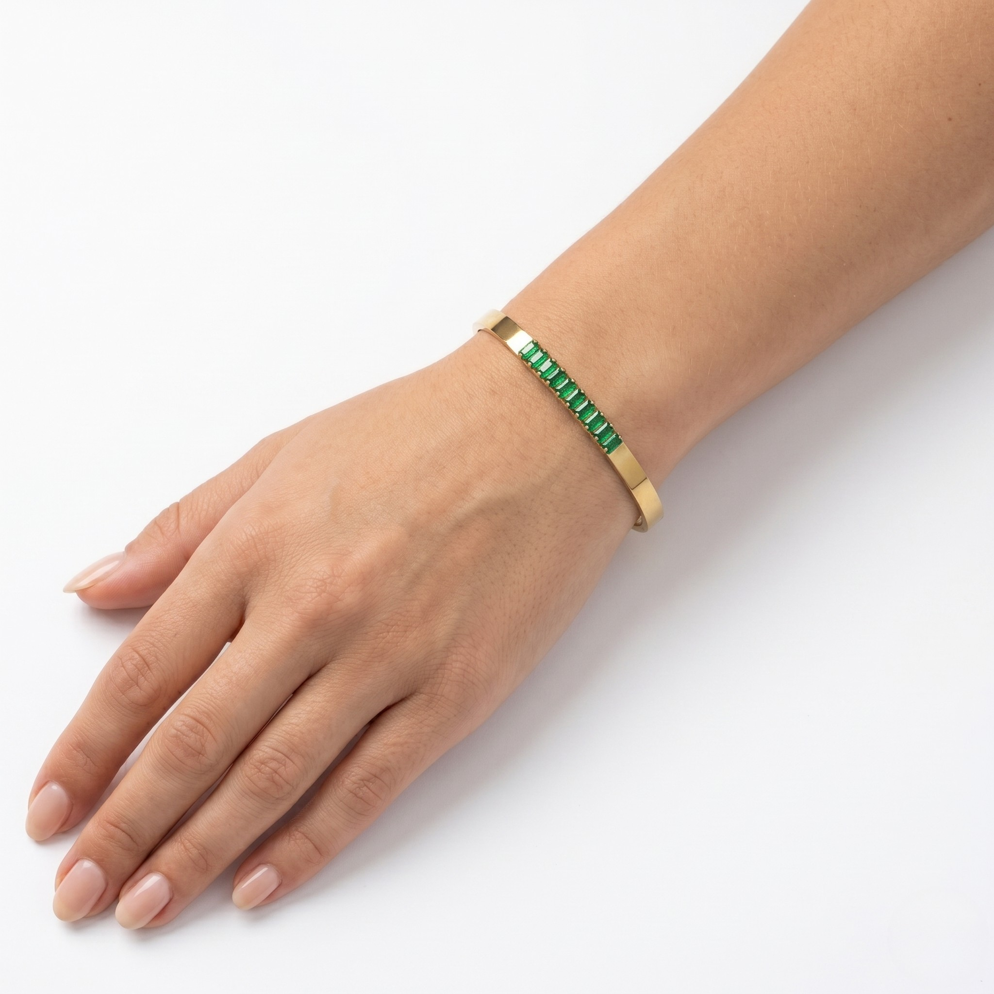 Hand wearing a green beaded bracelet on a white background- J.Collins Jewelry