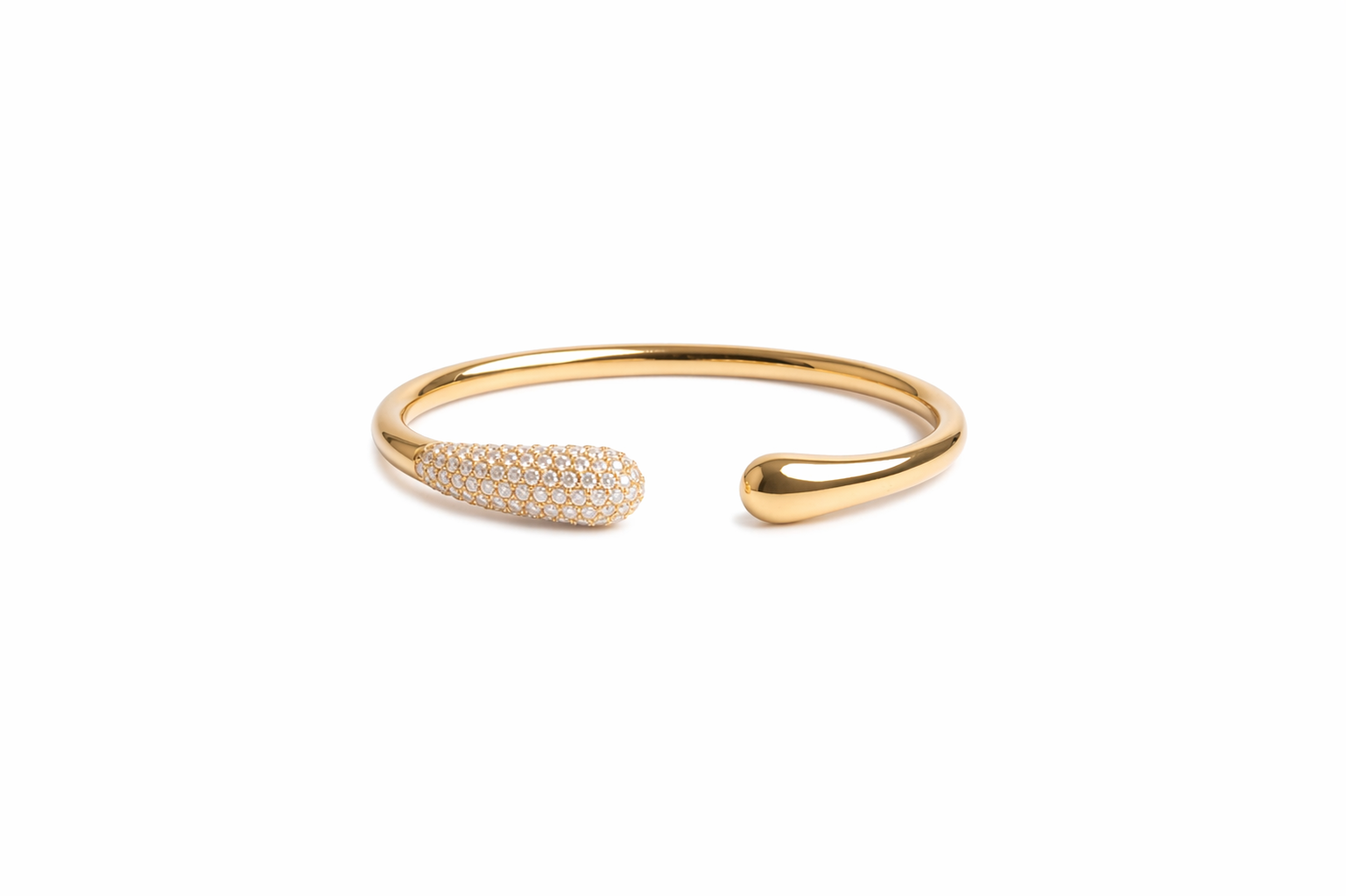 Gold bracelet with small stones on a white background-J.Collins Jewelry