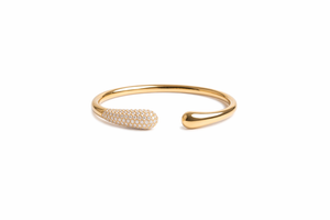 Gold bracelet with small stones on a white background-J.Collins Jewelry