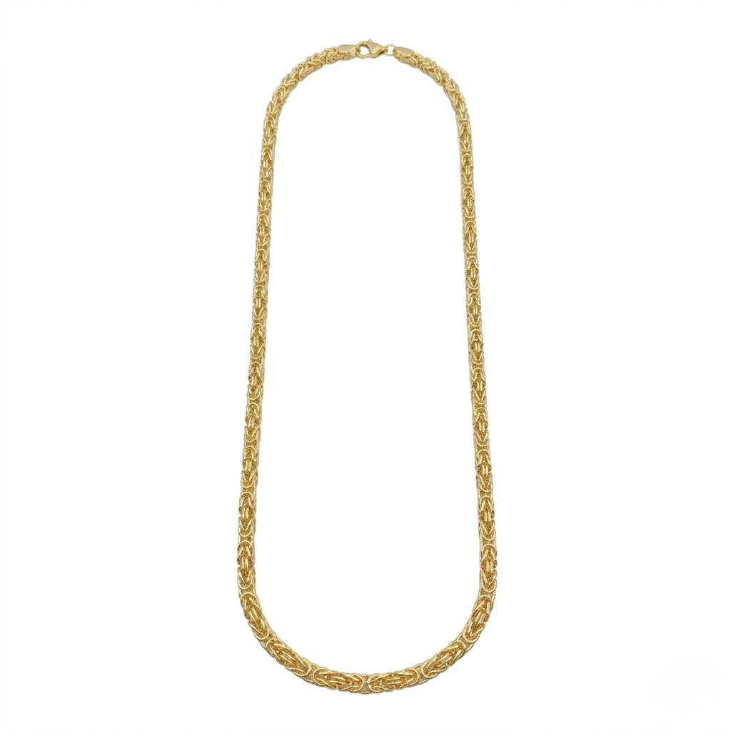 Gold mesh rope necklace on white background