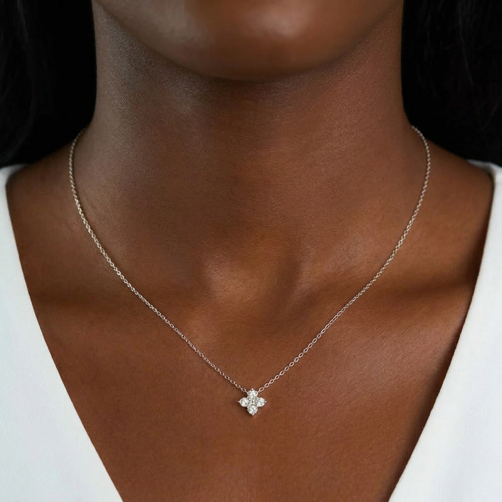 Necklace with a floral pendant on a person wearing a white top-J.Collins Jewelry