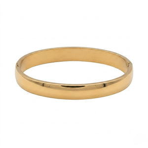 Polished Gold bracelet on a white background. J.Collins Jewelry 