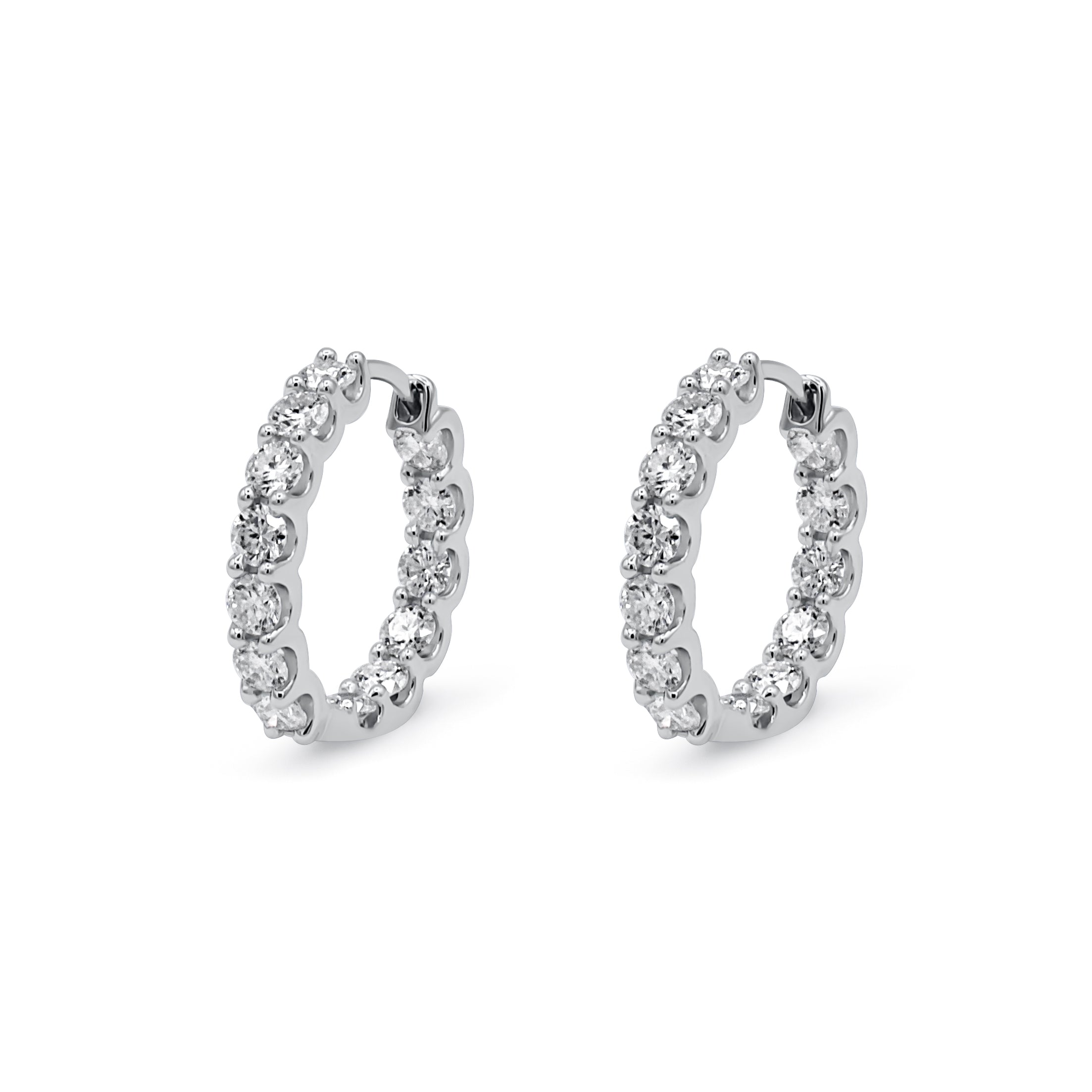 Pair of silver hoop earrings with clear stones on a white background-Radiance-Hoops-JCollins