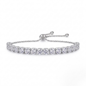 White gold bracelet with clear gemstones on a white background- J.Collins