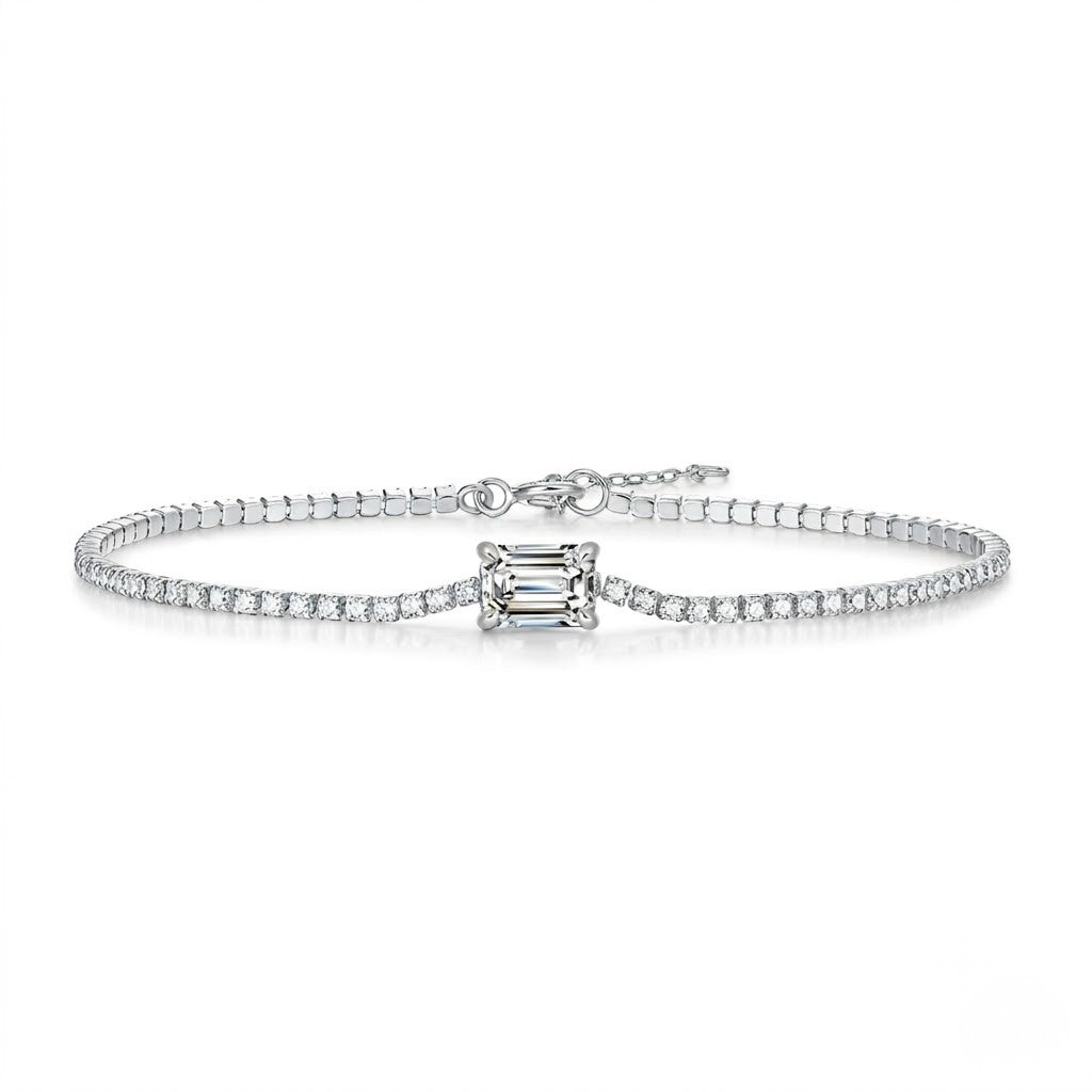 Diamond bracelet with a central square-cut gemstone on a white background - J.Collins Jewelry