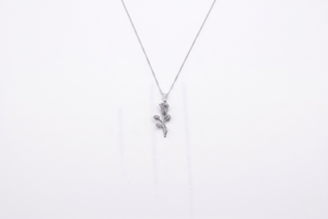 Silver necklace with a floral pendant on a white background- J.Collins Jewerly