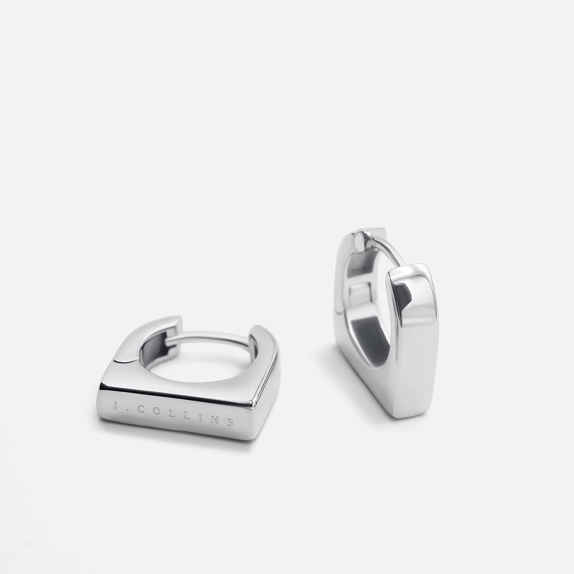 Silver hoop earrings on a white background - Signature JC Hoop - JCollins Jewelry 