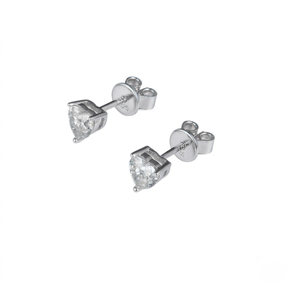 A pair of silver stud earrings with heart-shaped clear gemstones, shown on a plain white background. J.Collins Jewelry 