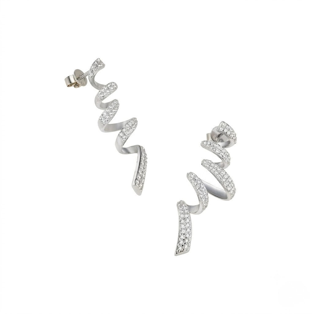 A pair of silver spiral drop earrings paved with small clear stones, shown on a plain white background. J. Collins Jewelry 
