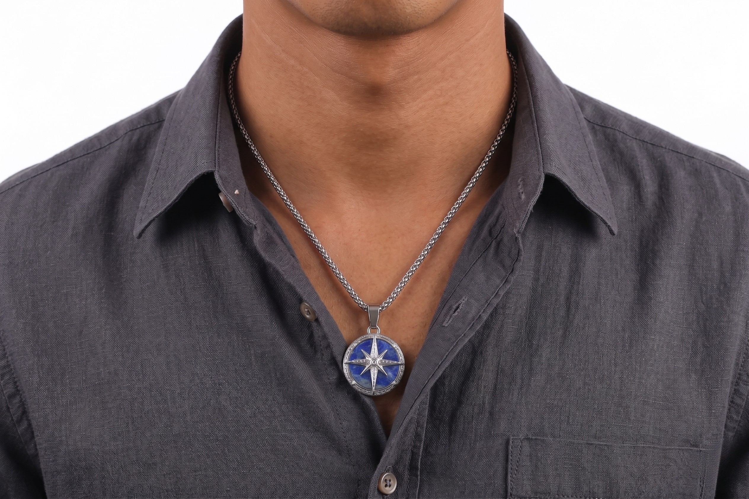 Man wearing a dark gray shirt with a necklace featuring a blue and silver pendant- J.Collins Jewelry