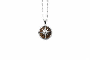 Necklace with a circular pendant featuring a star design on a white background-J.Collins Jewelry
