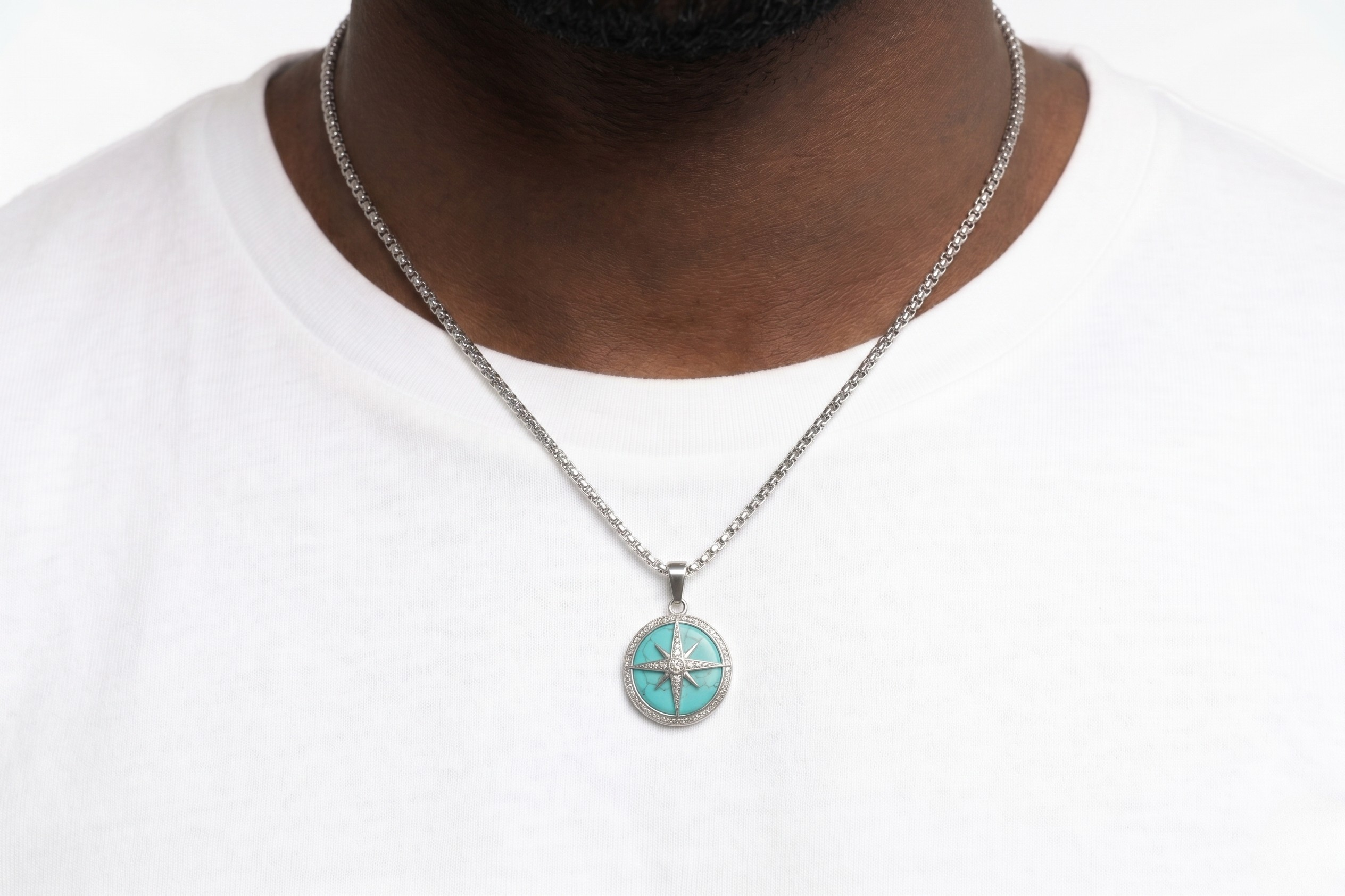 Necklace with a turquoise pendant worn by a person on a white background- J.Collins Jewelry
