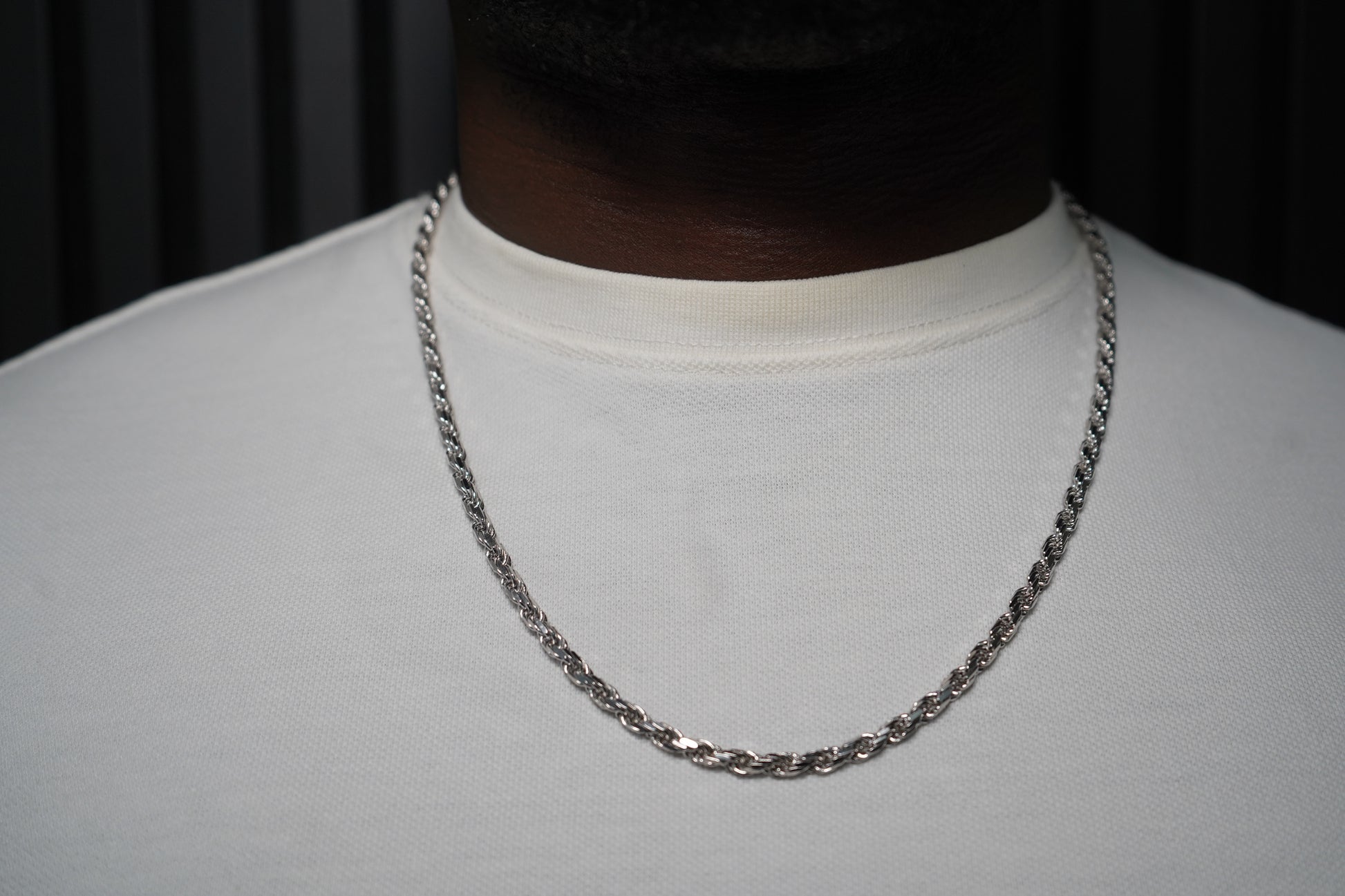 Silver chain necklace on a plain background-Sterling-Rope-Chain-JCollins-Jewelry