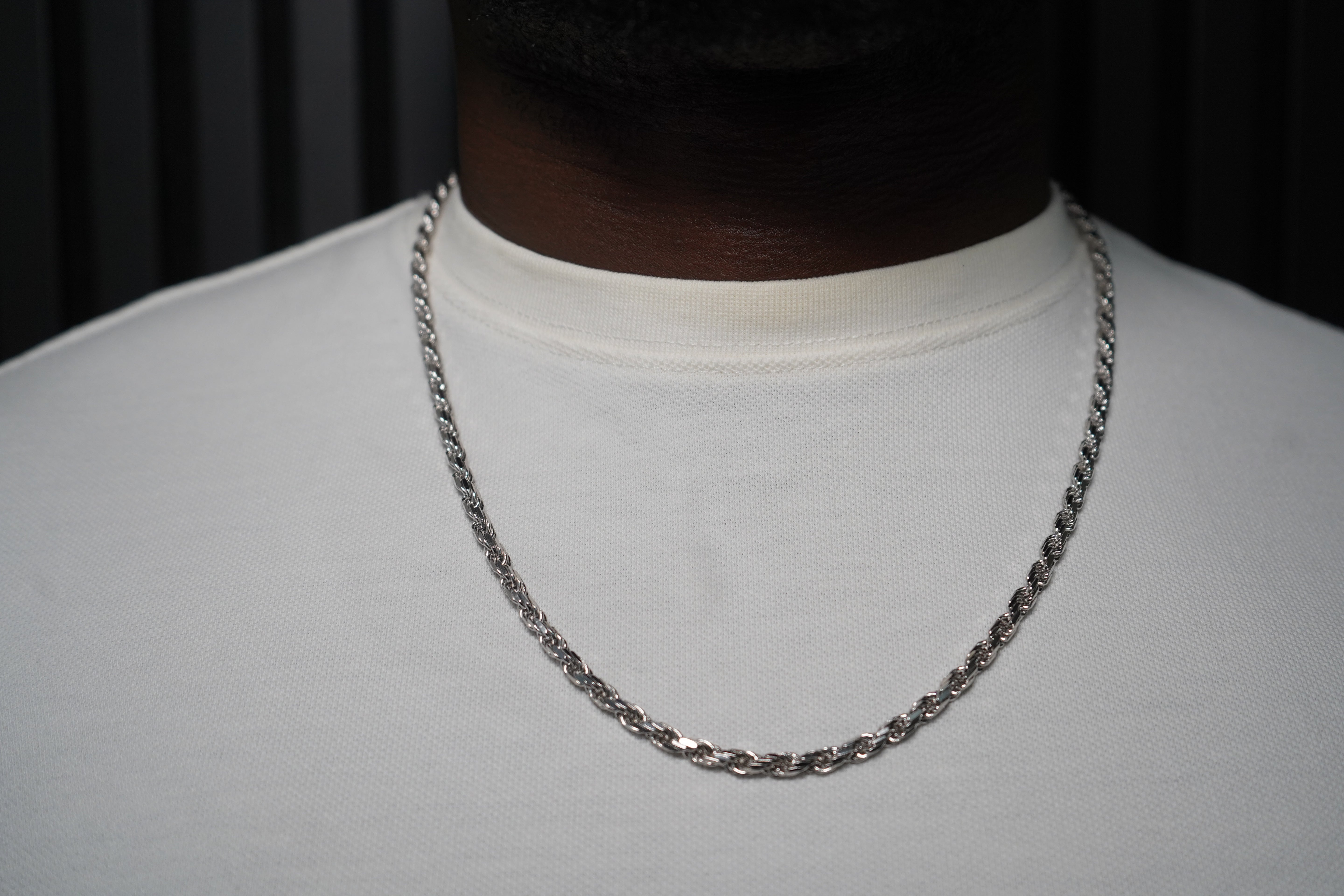 Silver chain necklace on a plain background-Sterling-Rope-Chain-JCollins-Jewelry