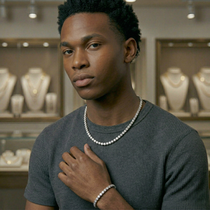 Man wearing a tennis chain necklace &  tennis chain bracelet  in a jewelry store - Tennis Chain 5mm (Gold) by J.Collins Jewelry 