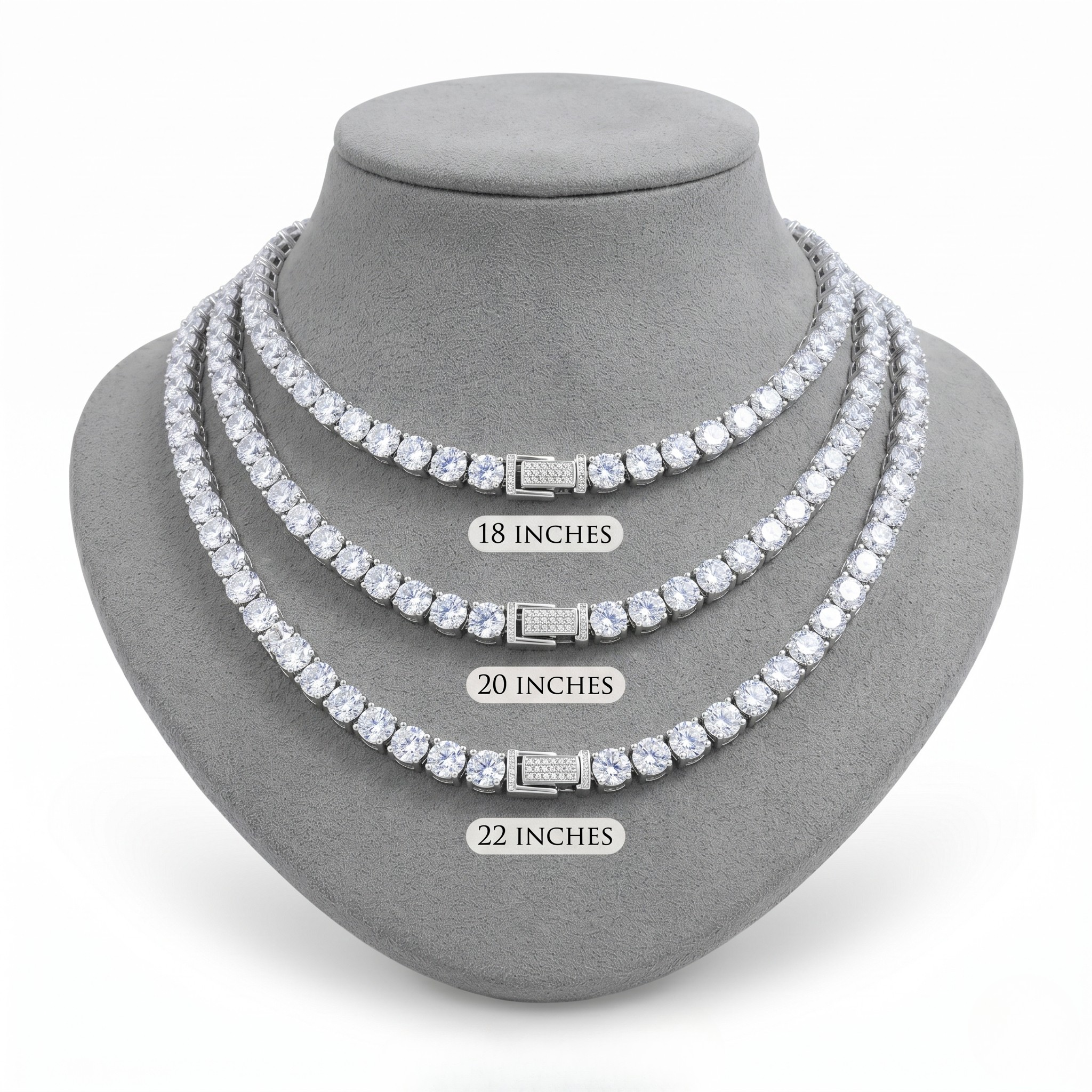 Set of three diamond tennis necklaces on a gray stand with measurement labels. J. Collins Jewelry 