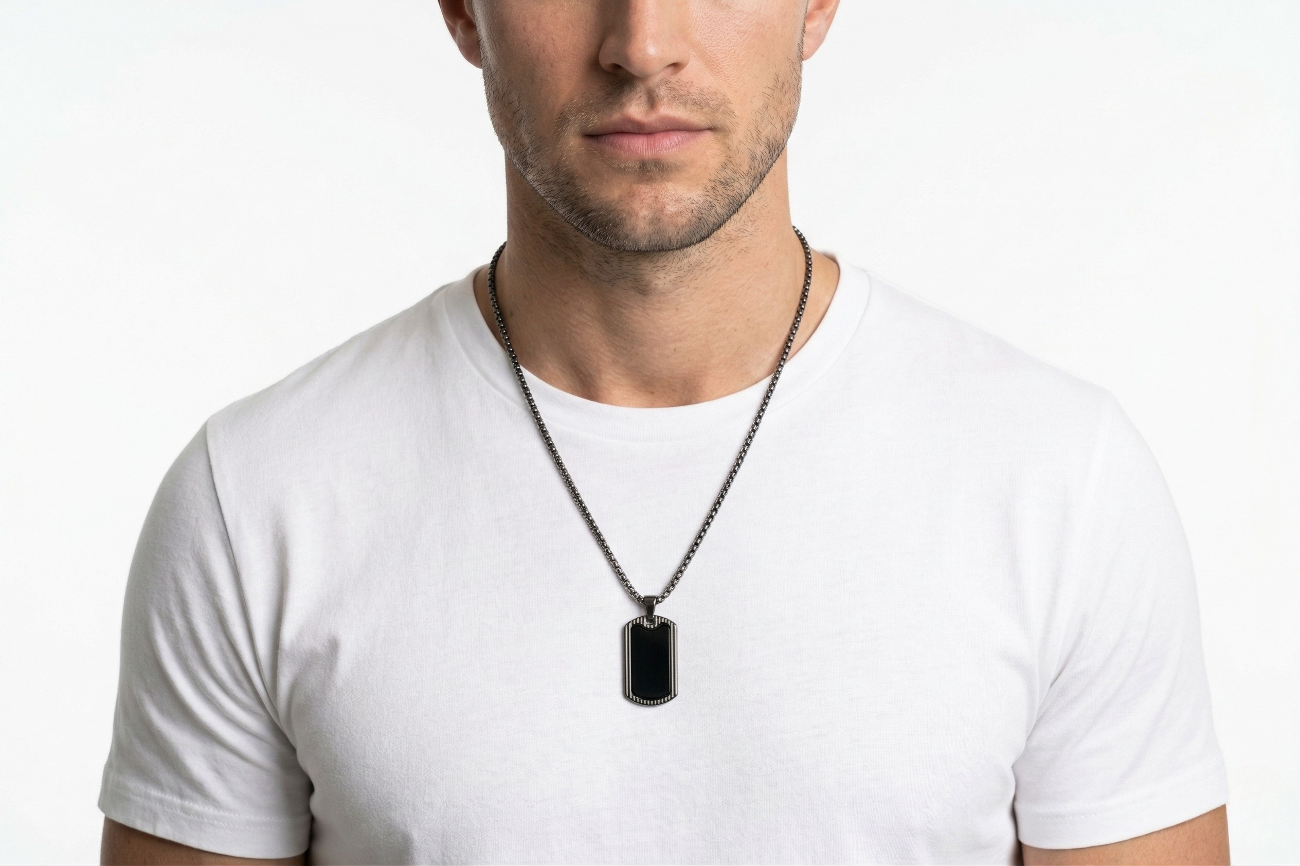 Man wearing a necklace with a black pendant on a white background-J.Collins Jewelry