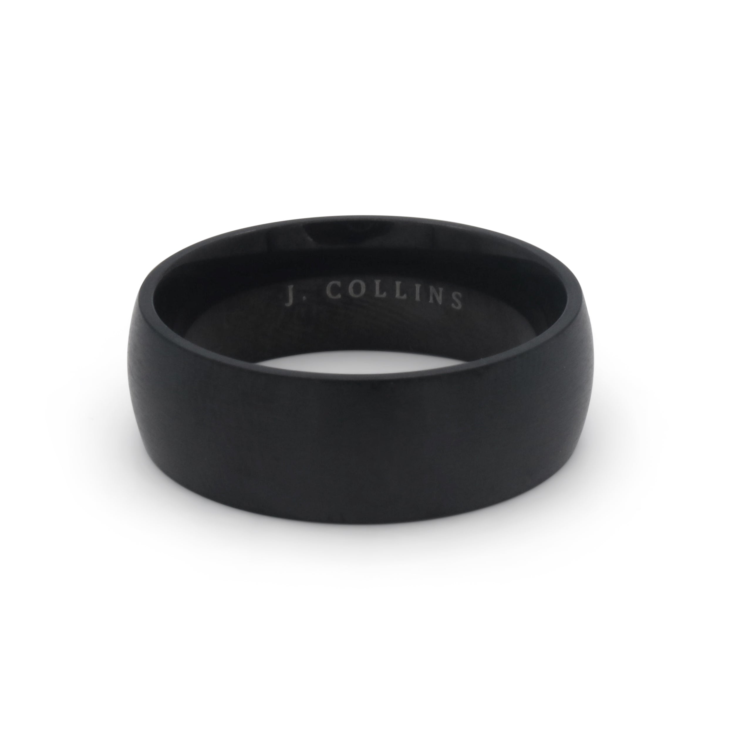 The Nightfall ring with 'J. Collins' engraving on a white background