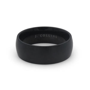 The Nightfall ring with 'J. Collins' engraving on a white background