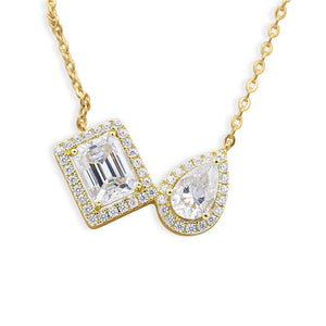Gold Toi et Moi Emerald-Cut and Pear-Cut Diamond Double Halo Pendant Necklace Close-Up on White Background - J. Collins Jewelry 