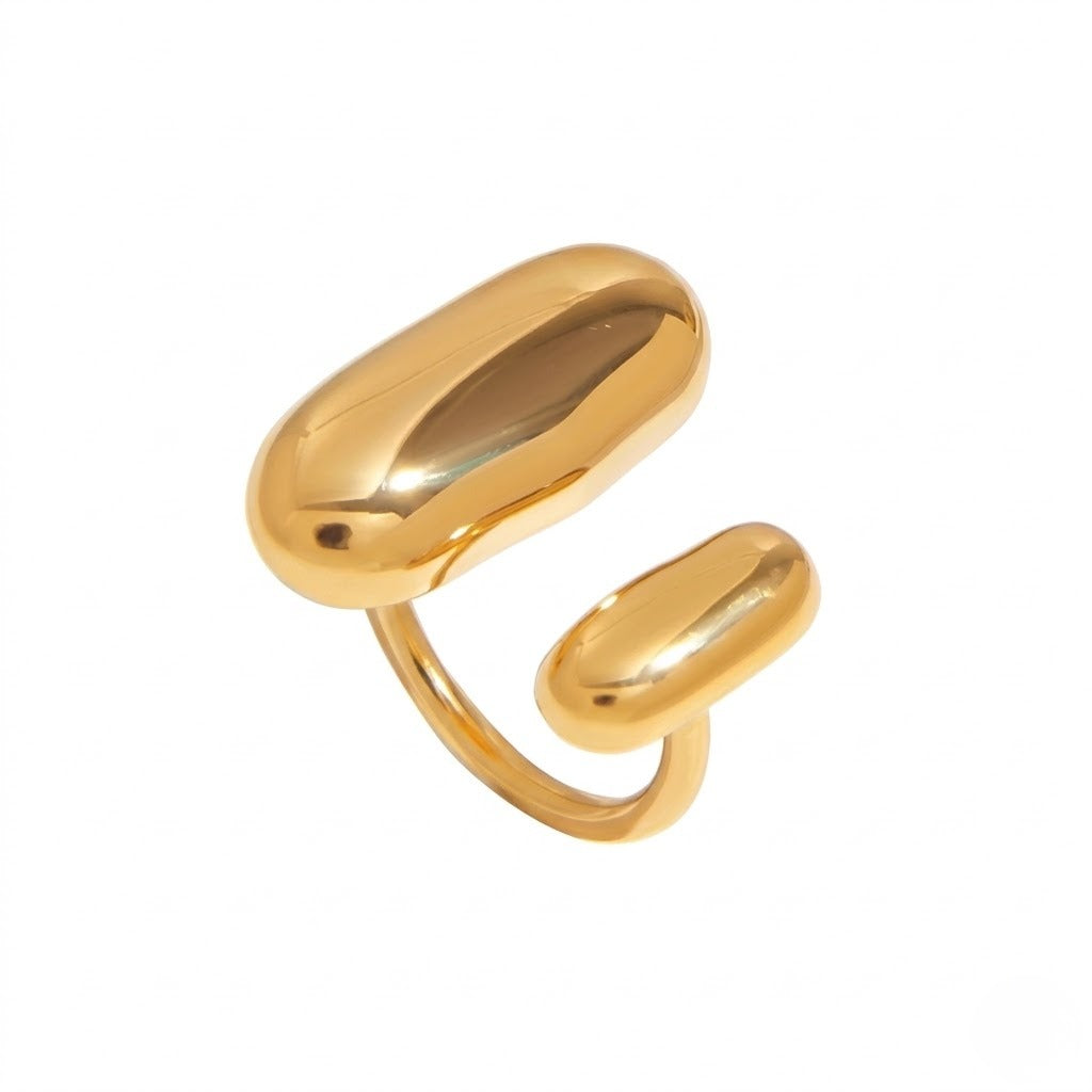 A polished gold-toned open ring with two rounded, capsule-like ends, shown on a plain white background - J.Collins Jewelry