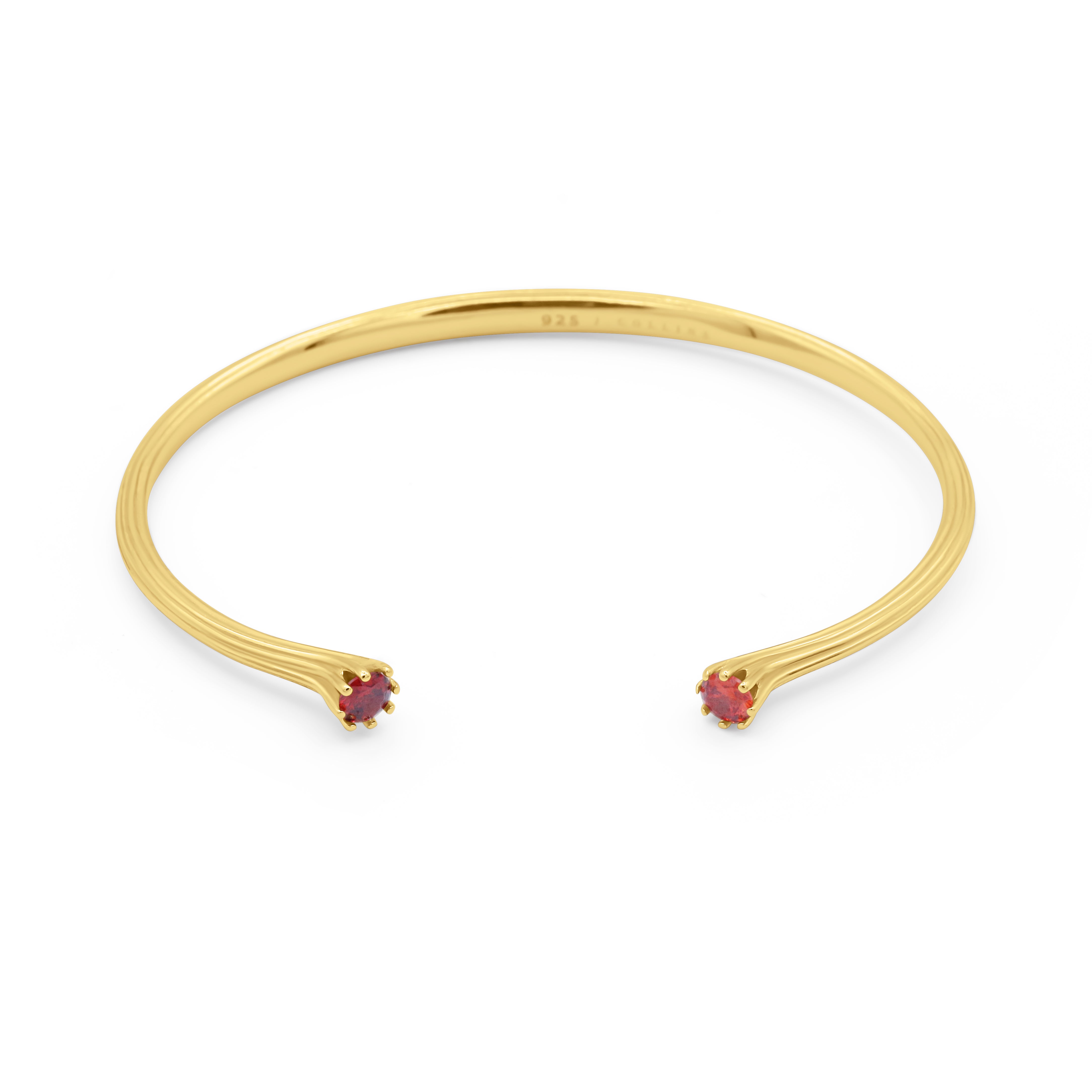 Gold bracelet with red gemstones on a white background - Valora Cuff - JCollins Jewelry 