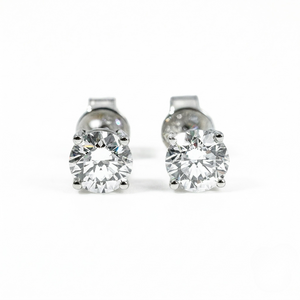 Pair of silver stud earrings with clear gemstones on a white background. - White Gold Diamond Earrings - J. Collins Jewelry 