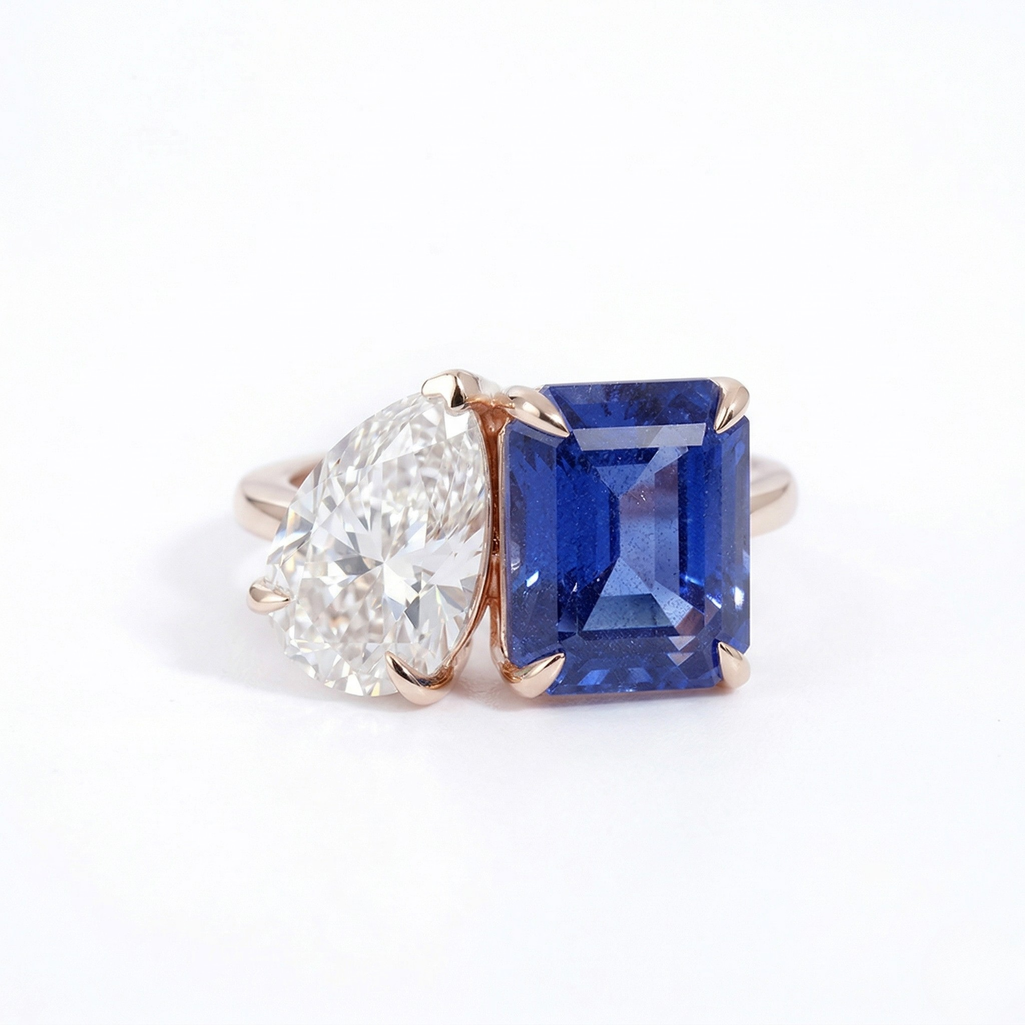 14K rose gold ring with pear-cut lab diamond and emerald-cut blue sapphire stones