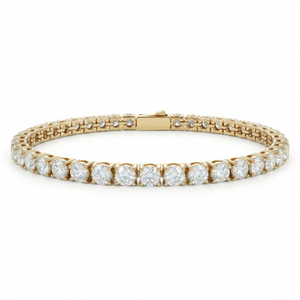 Gold tennis bracelet with round diamonds, 5mm width, featuring a classic design and secure clasp.