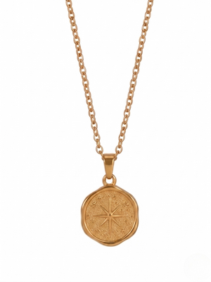 Gold Voyager Coin Pendant on chain with compass design, featuring a textured finish, by J.Collins Jewelry.