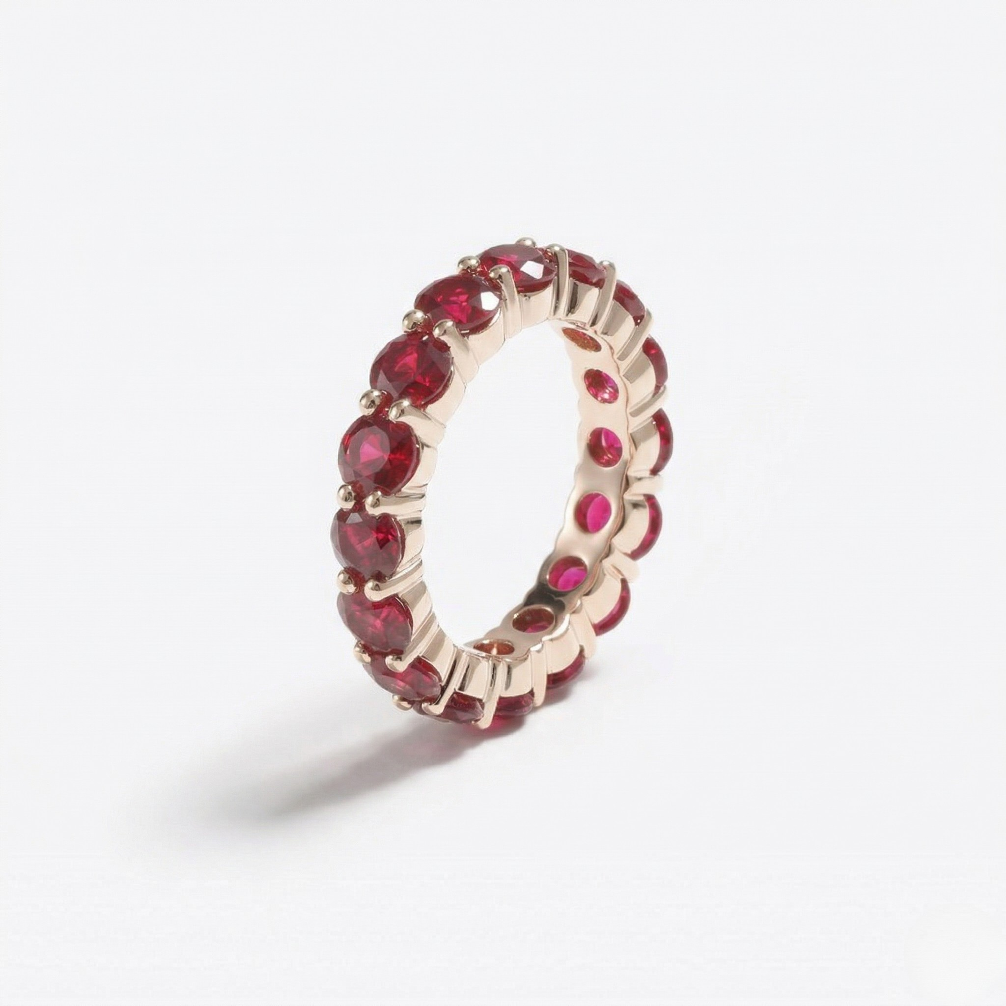 14K yellow gold ring with lab-created rubies in a continuous band design