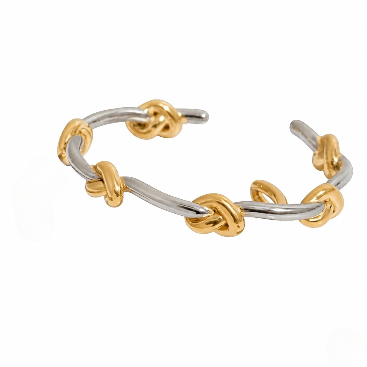 Duet Knot Bangle; two-tone silver and gold bracelet with knot accents, open cuff design.