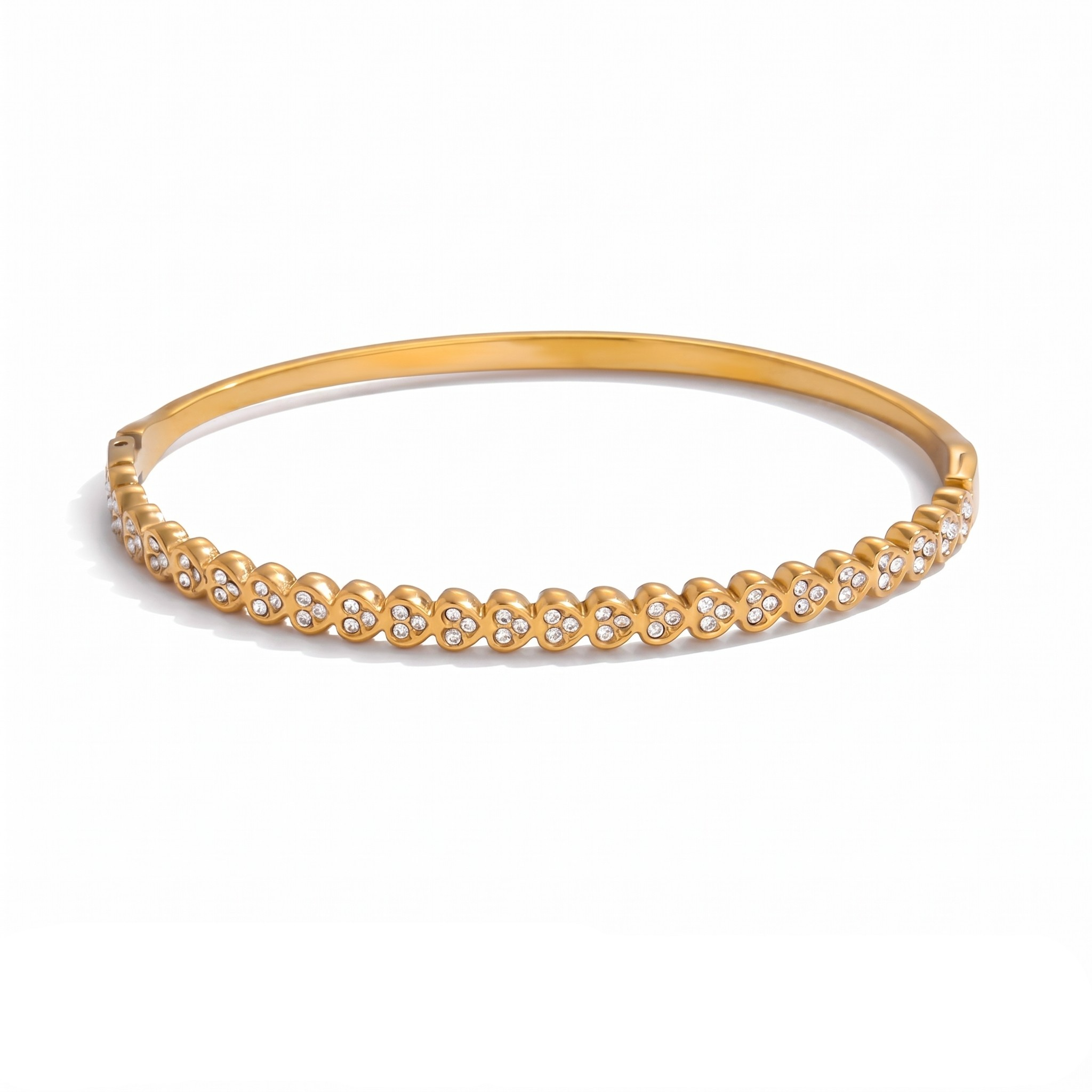 Gold-tone stainless steel bangle with a cluster design featuring small sparkling stones.