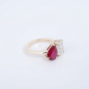 14K yellow gold ring with pear-shaped moissanite and ruby stones