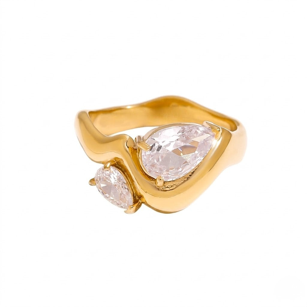 Gold ring with twin pear-shaped gemstones in a curved band design