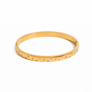 Gold bracelet with scattered crystals, sleek and elegant design from J.Collins Jewelry
