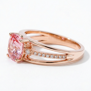 18K rose gold ring with a pink gemstone and diamond accents, modern split shank design