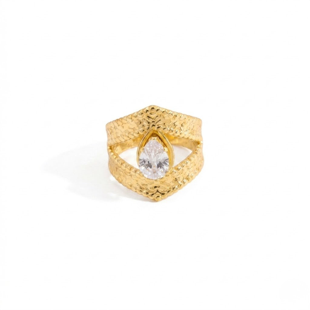 Gold teardrop ring with textured band and clear central stone, by J.Collins Jewelry
