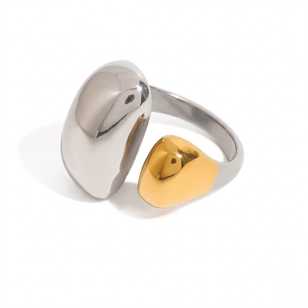 Two-tone metal Elite Capsule Ring with a sleek, modern design featuring silver and gold tones.