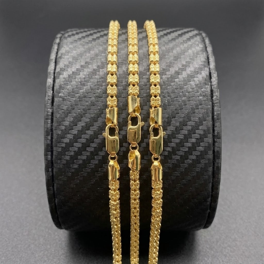 Vermeil gold link necklaces with 4mm width displayed on a black textured jewelry holder