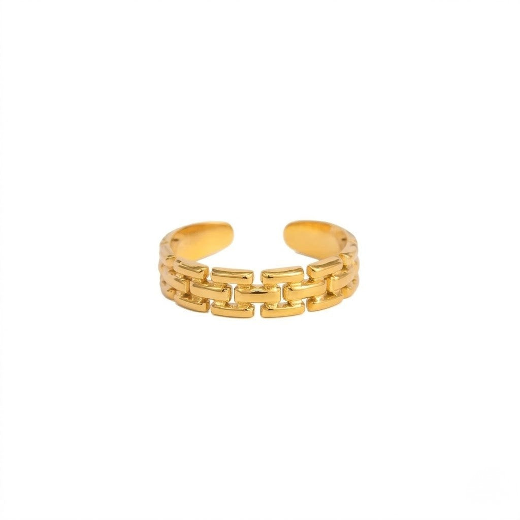 Gold open masonry linked ring with intricate chain-like design on white background