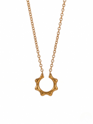 Gold pendant necklace with a sunburst design and delicate chain, Noble Ray Pendant by J.Collins Jewelry.