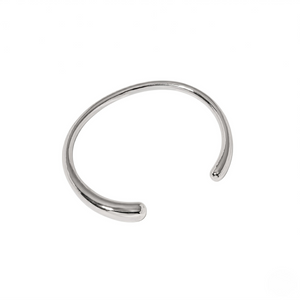 Silver essential cuff bracelet in minimalist style on white background