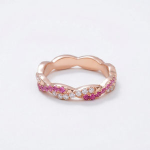 14K rose gold ring with lab-grown rubies and diamonds in a twisted band design
